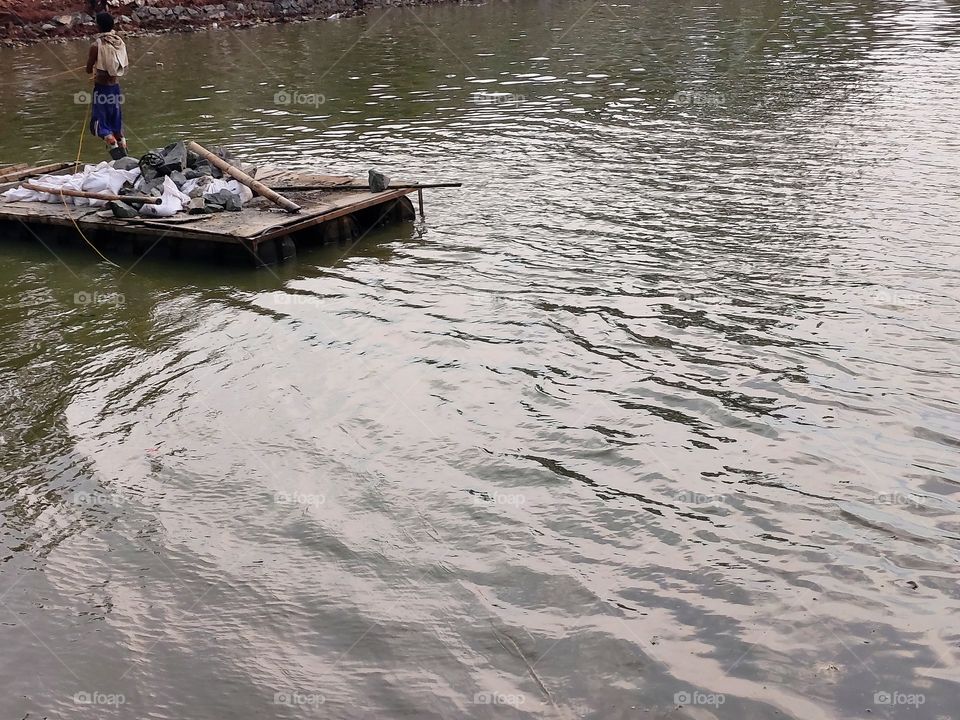 transporting rocks on the lake