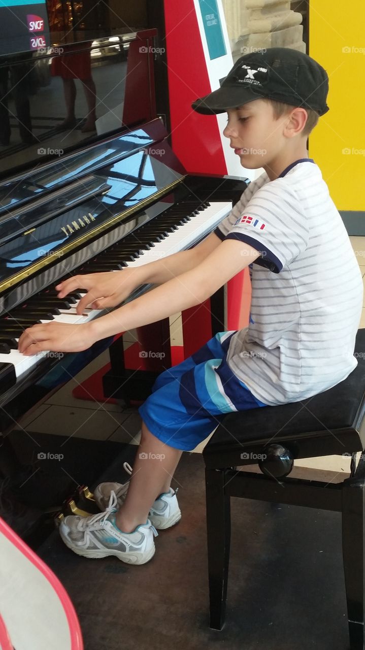 my son with the piano