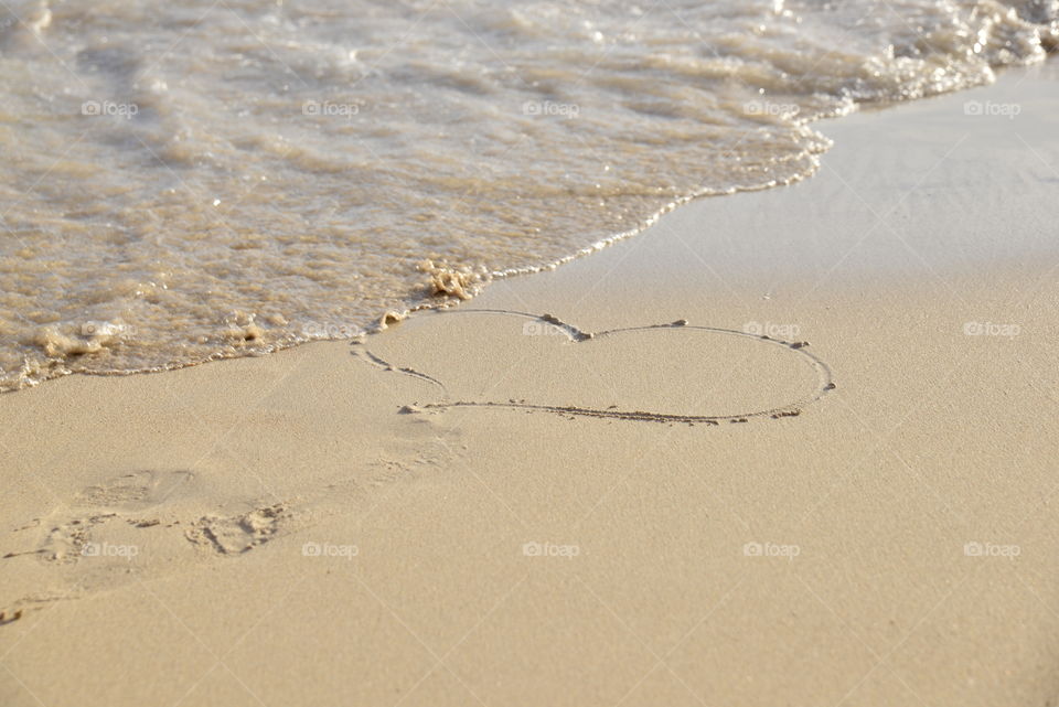 Heart writen on the sand