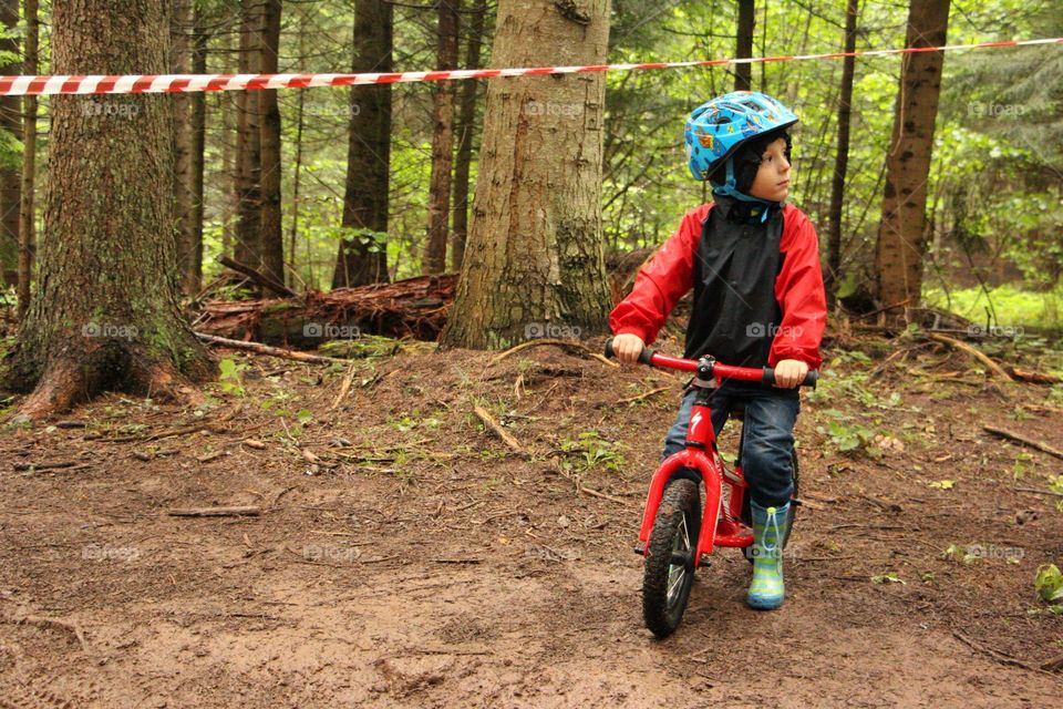 Child riding bike in the nature