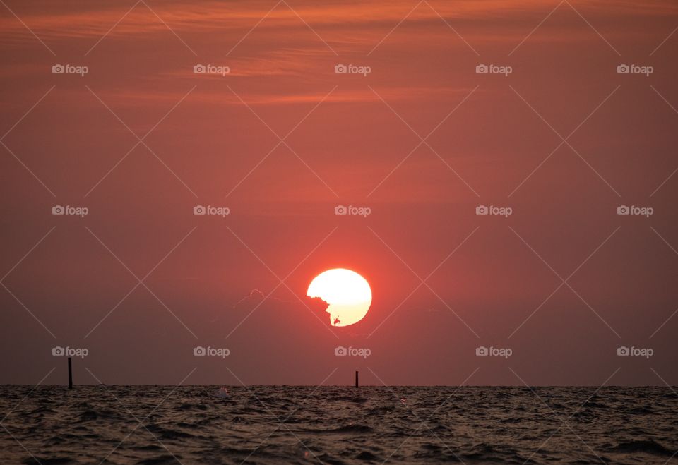 Sun set into the sea at Beautiful famous beach Pattaya Thailand