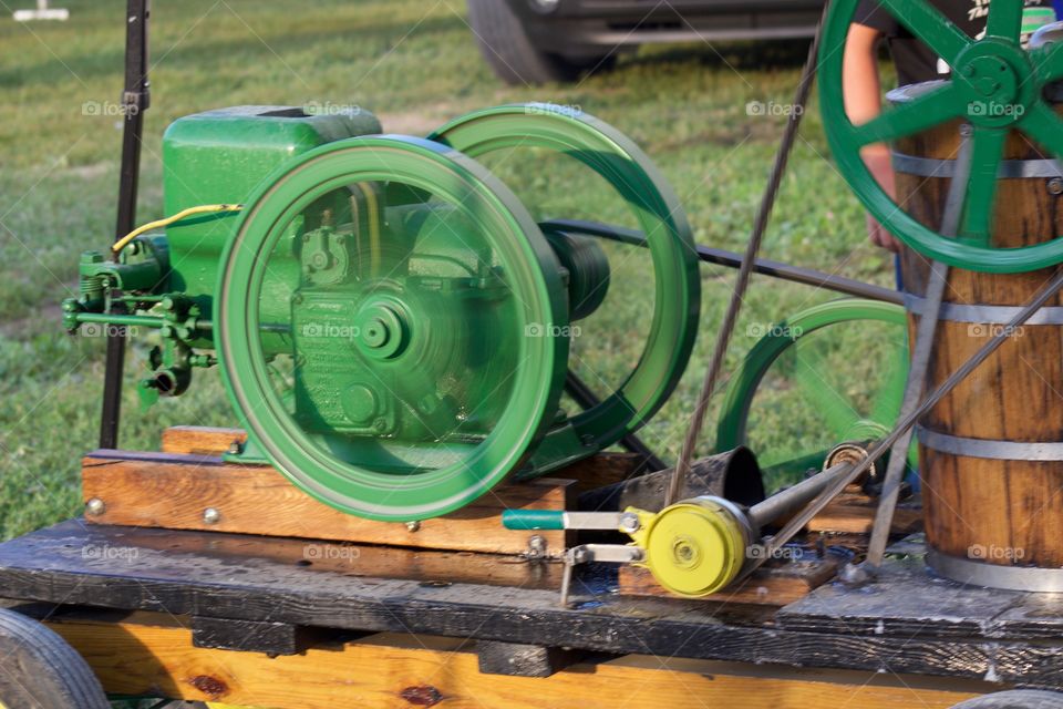 Ice cream maker powered by an engine at a county fair