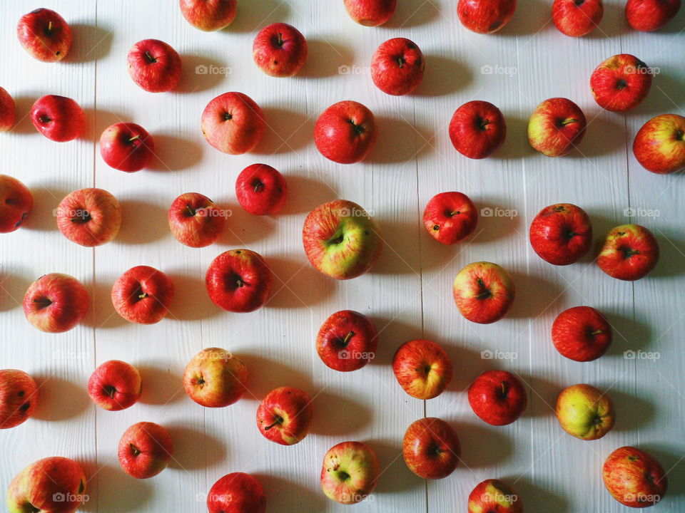 a lot of red apples on a white background