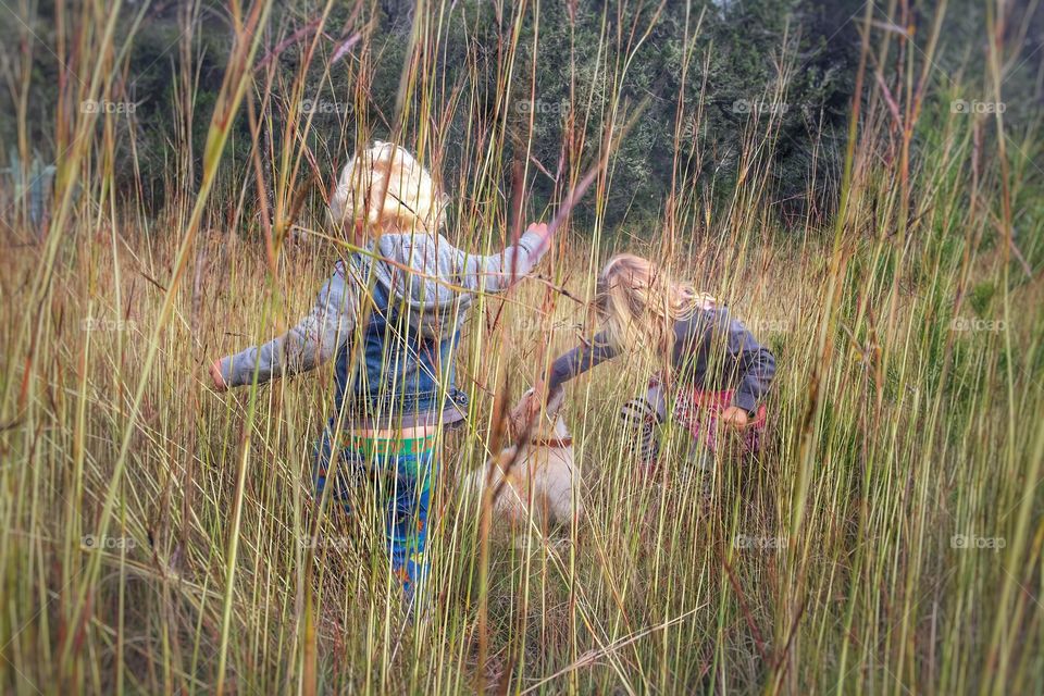 Children playing in grass