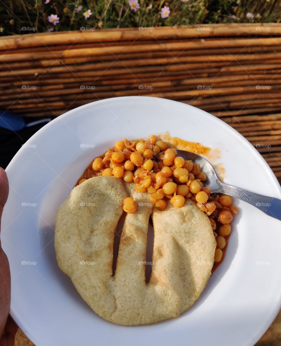 Indian dish very tasty white peas curry with puri