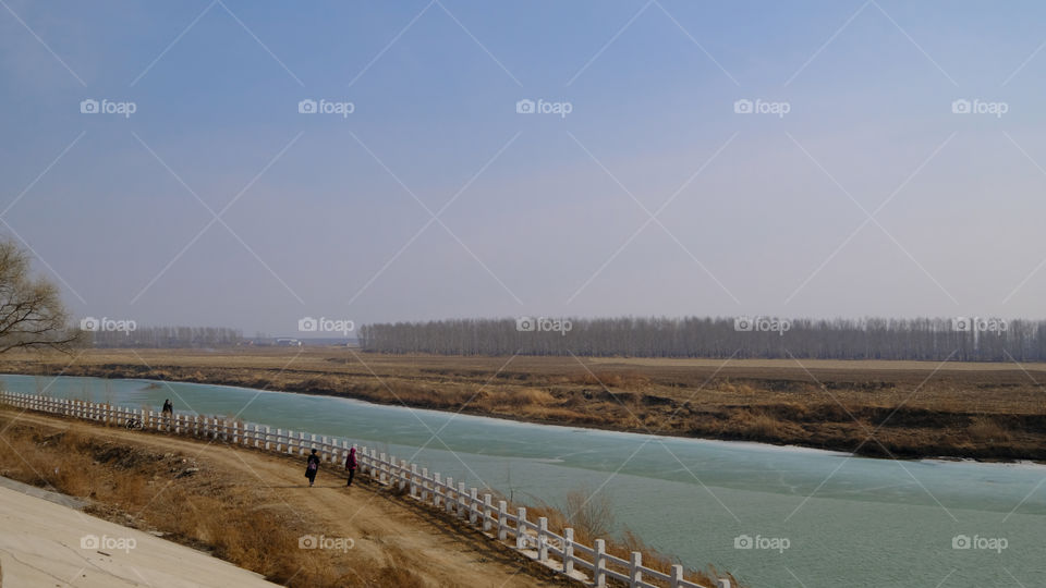 the ice on the river is melting