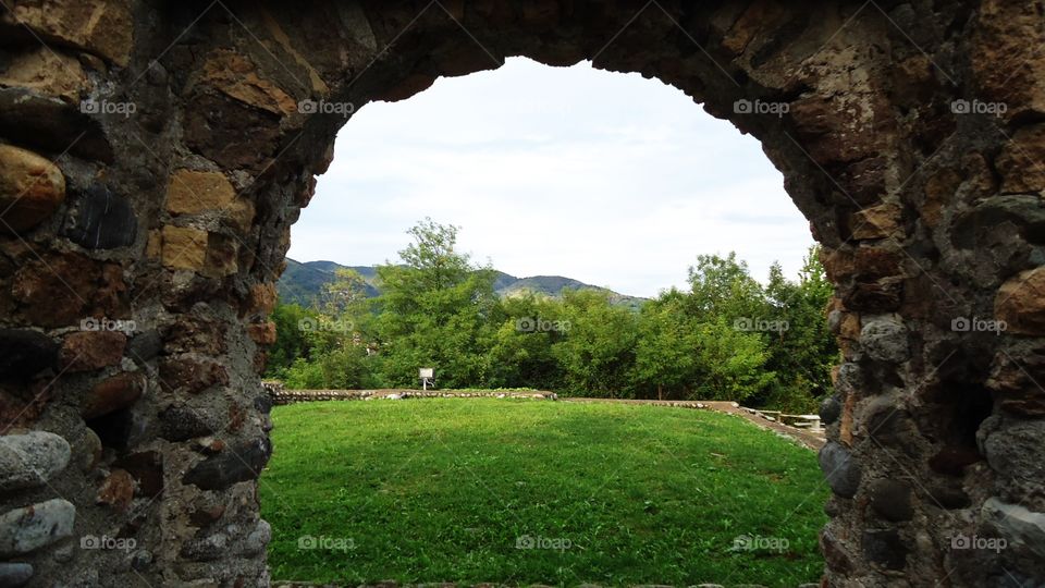 Peering through the arch
