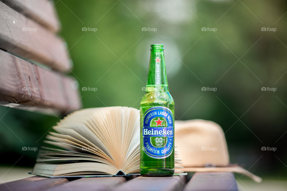 Nonalcoholic Heineken beer with book 