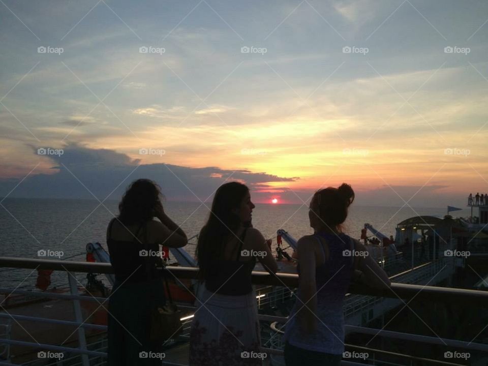 Watching the sunset on a cruise boat 