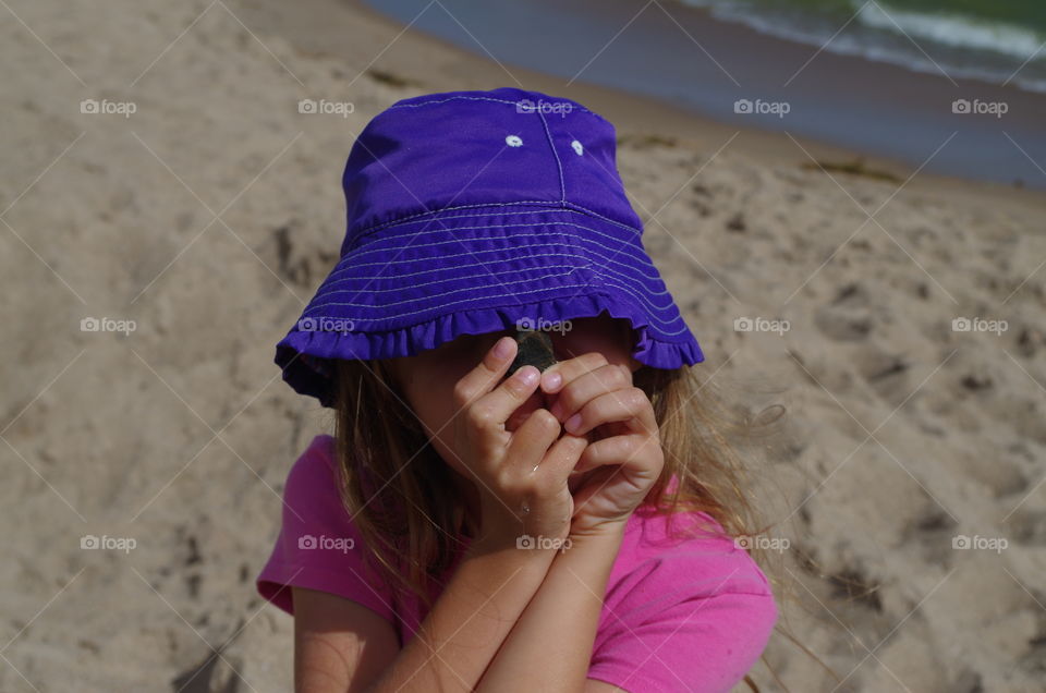 Close-up of a girl holding stone