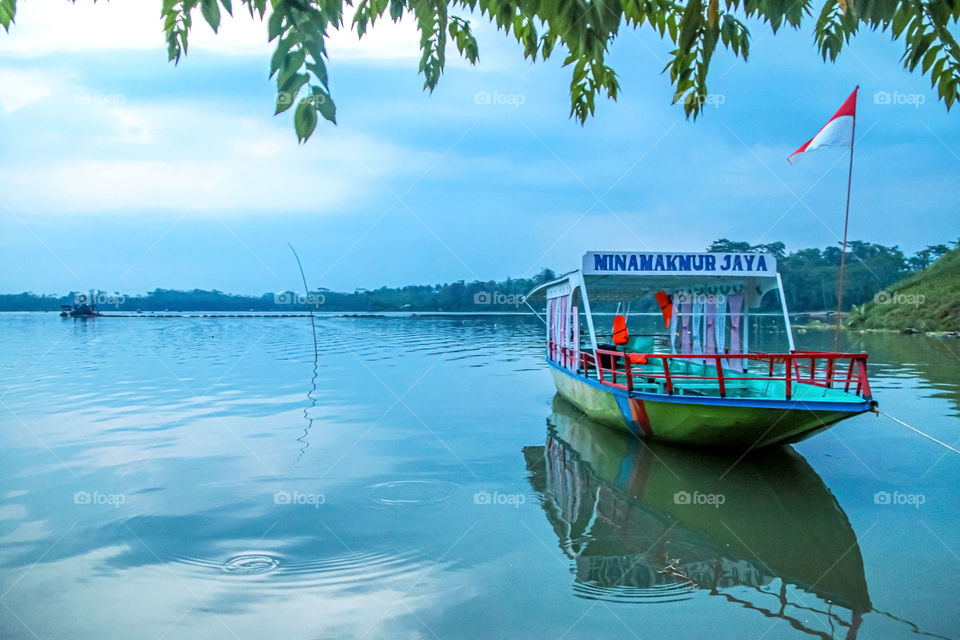 The reflection of the ship in the water makes the view more beautiful.