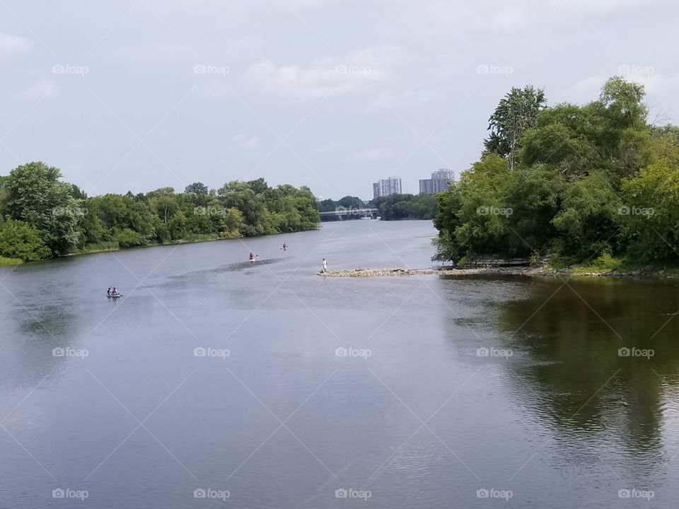 Paddleboarding on the Rideau river,  downtown Ottawa, Canada