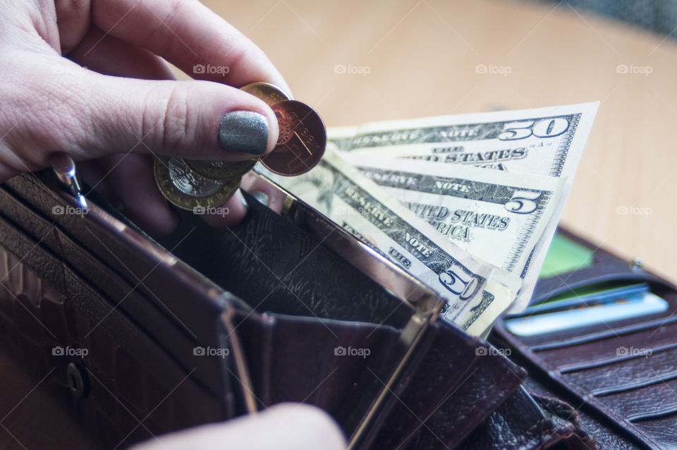 Close-up of a women's hand holding currency