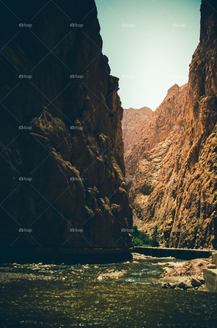 Scenic view of river by mountain