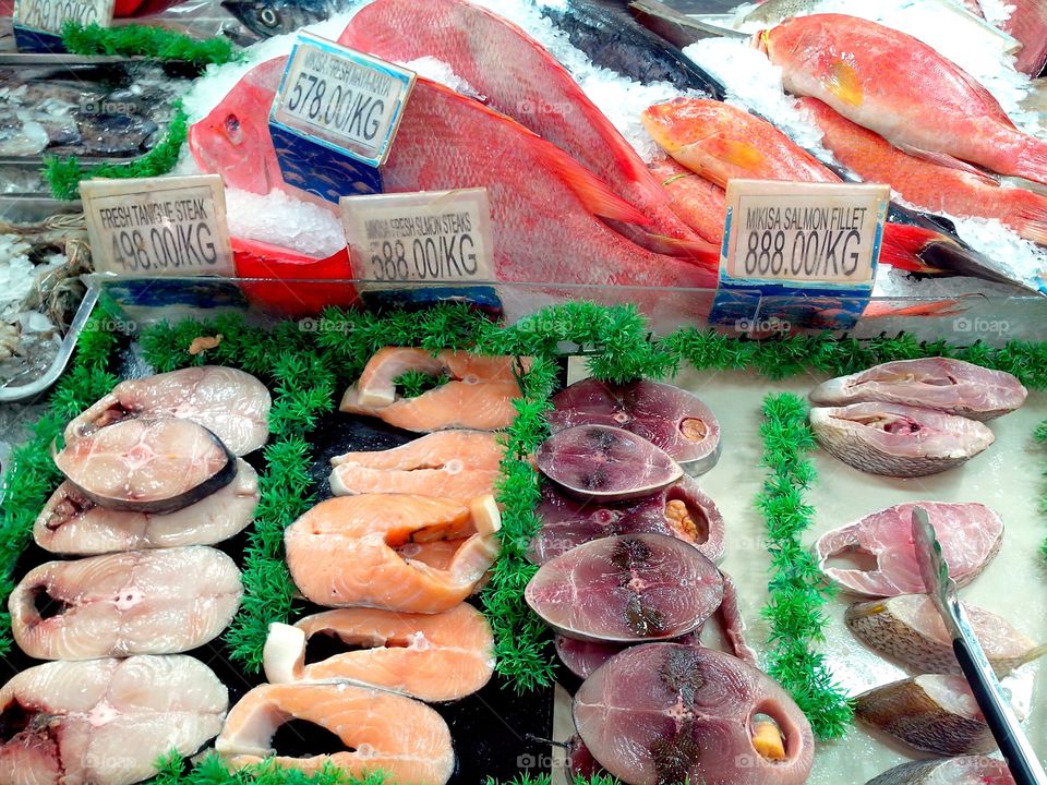 fresh raw fishes. fresh raw fishes sold at a supermarket