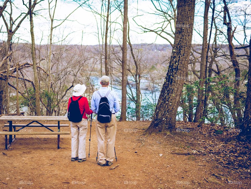 Elderly couple enjoy a stroll at Great Falls Park. 