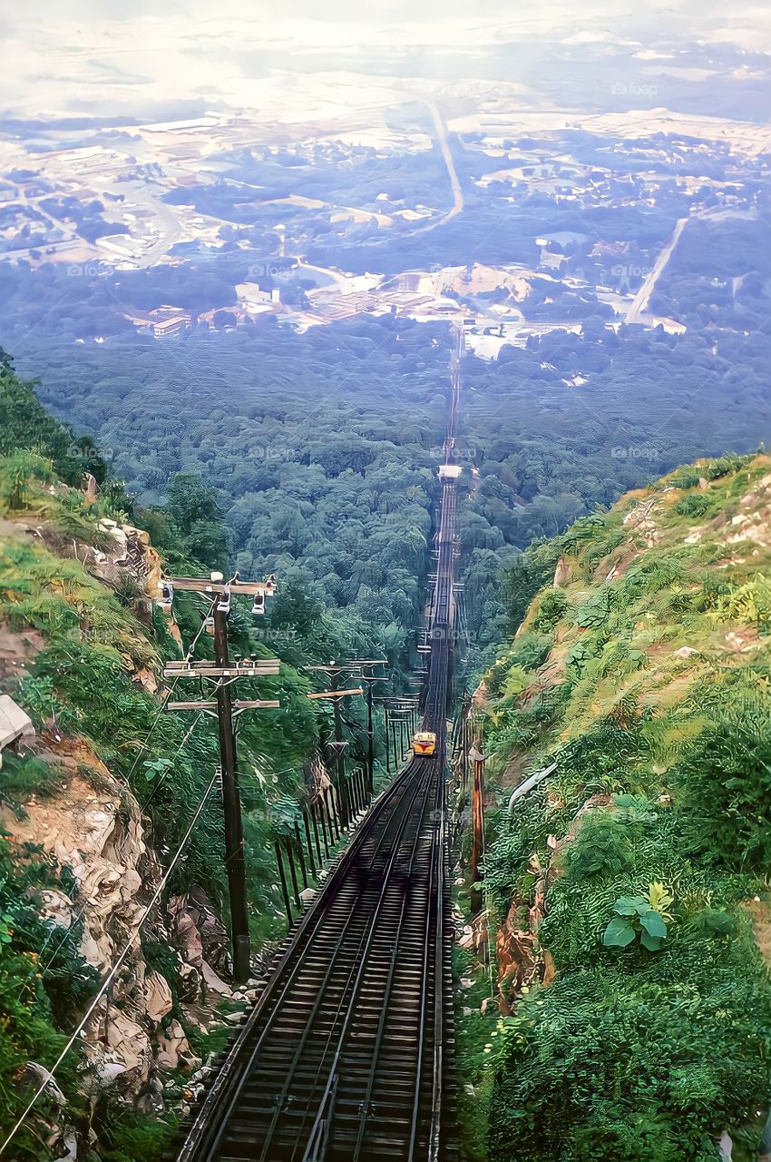 Electric Locomotive Track between mountains.
Electric Locomotive Track with train running between mountains in the background.