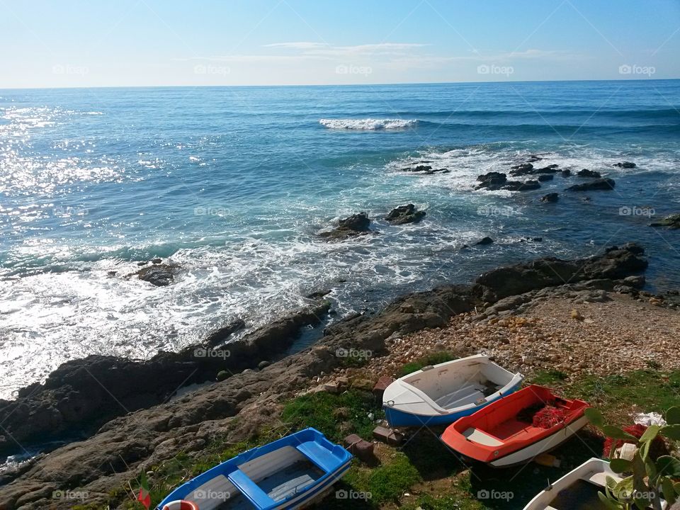 rocky beach with boat