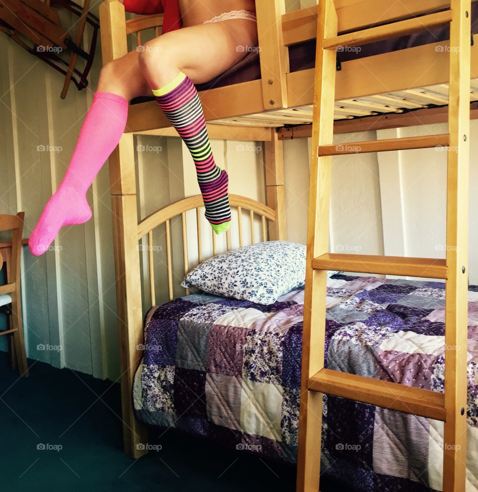 Low section of woman wearing long socks 