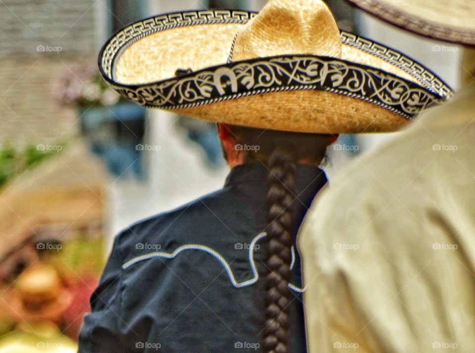 Mexican Cowboy. Cowboy With Long Braided Ponytail
