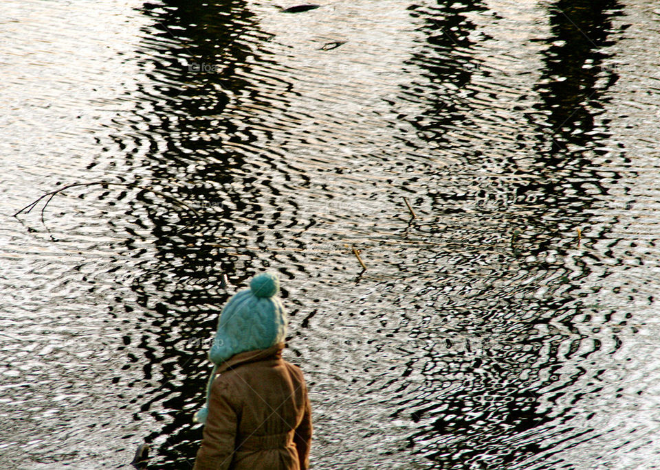 LITTLE GIRL AT THE LAKE