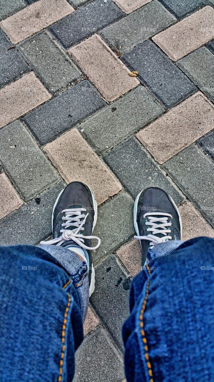 Taking a heat stroke break from walking.. And noticed this cool pavement.. Nassau Bahamas so I figured why not foot view