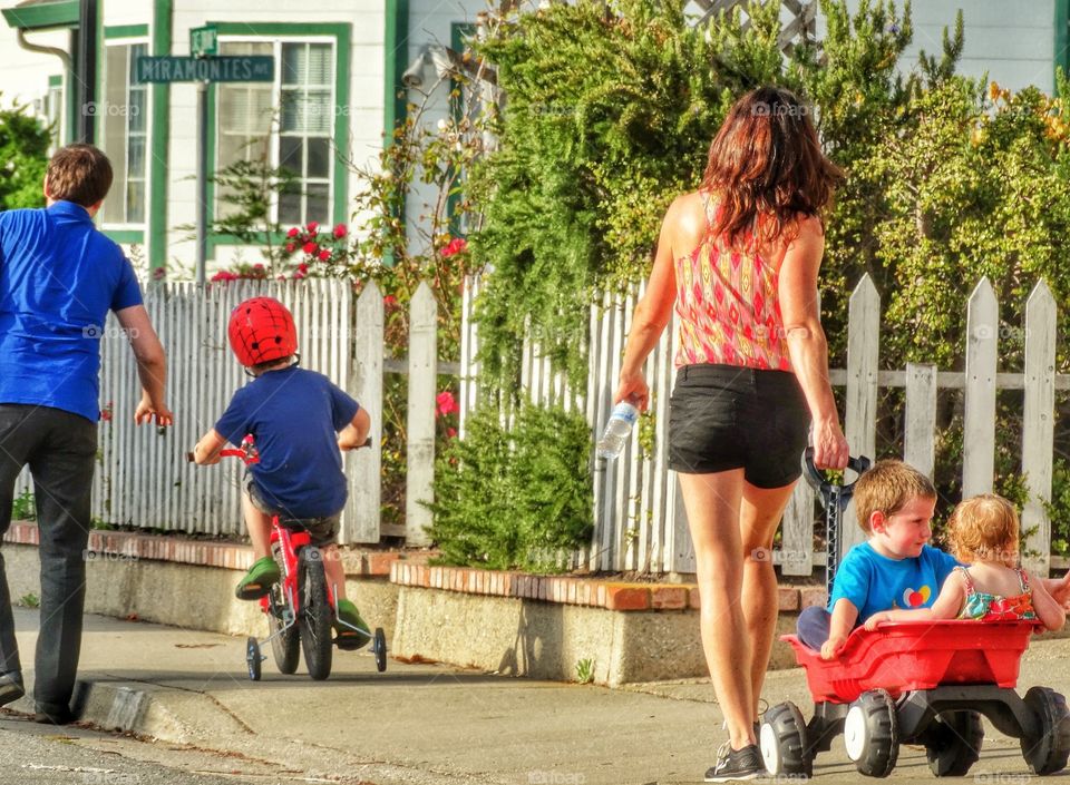 California Family Walking In Neighborhood During Summer