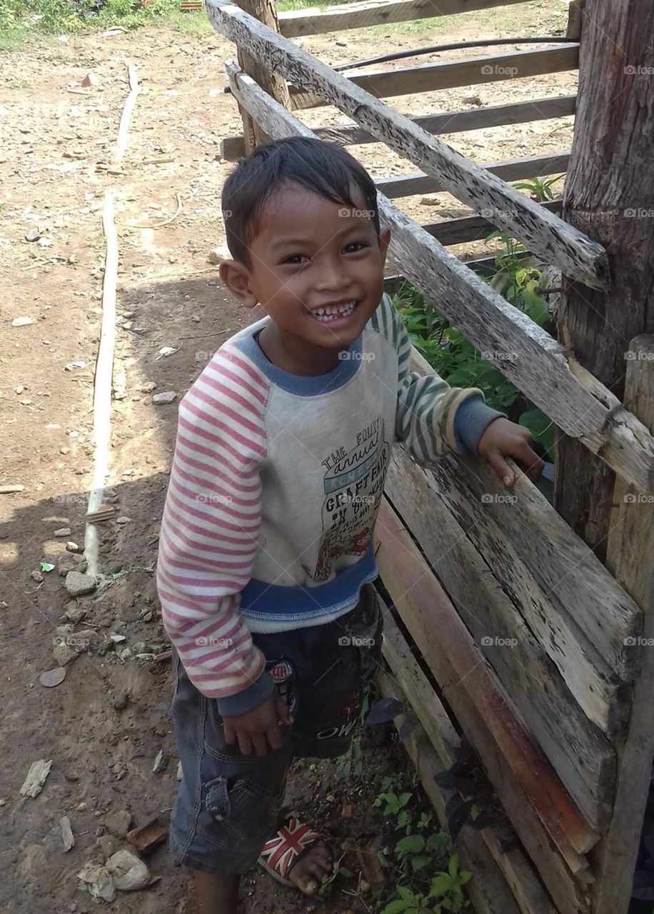 The bright smile of a child in the highlands
