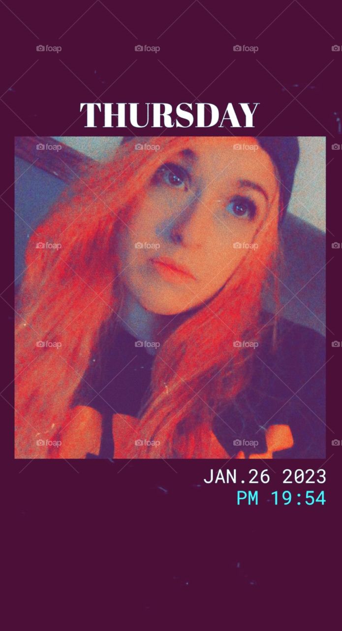 Pink haired snap chat filter of woman looking off camera 