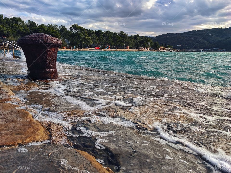 Sea tide on the Adriatic coast in winter. Scenic view of the adriatic seaside in Slovenia. Travel conception.