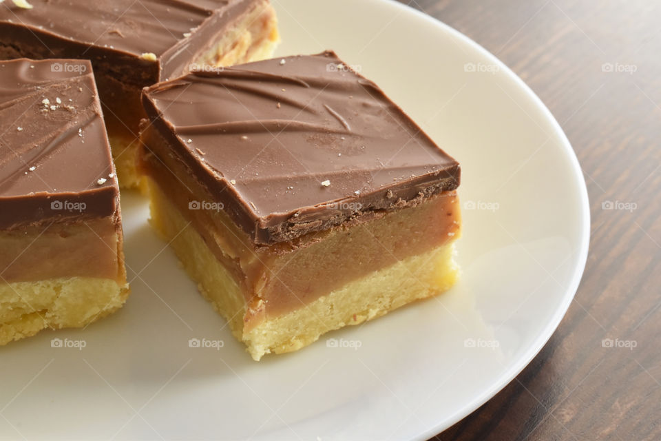Millionaire's shortbread, caramel shortcake, or millionaire's slice. Copy space is on the right side.
