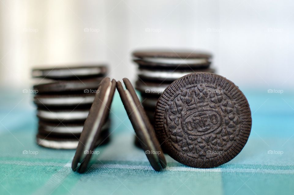 Oreo cookie thins on a white and light blue background 