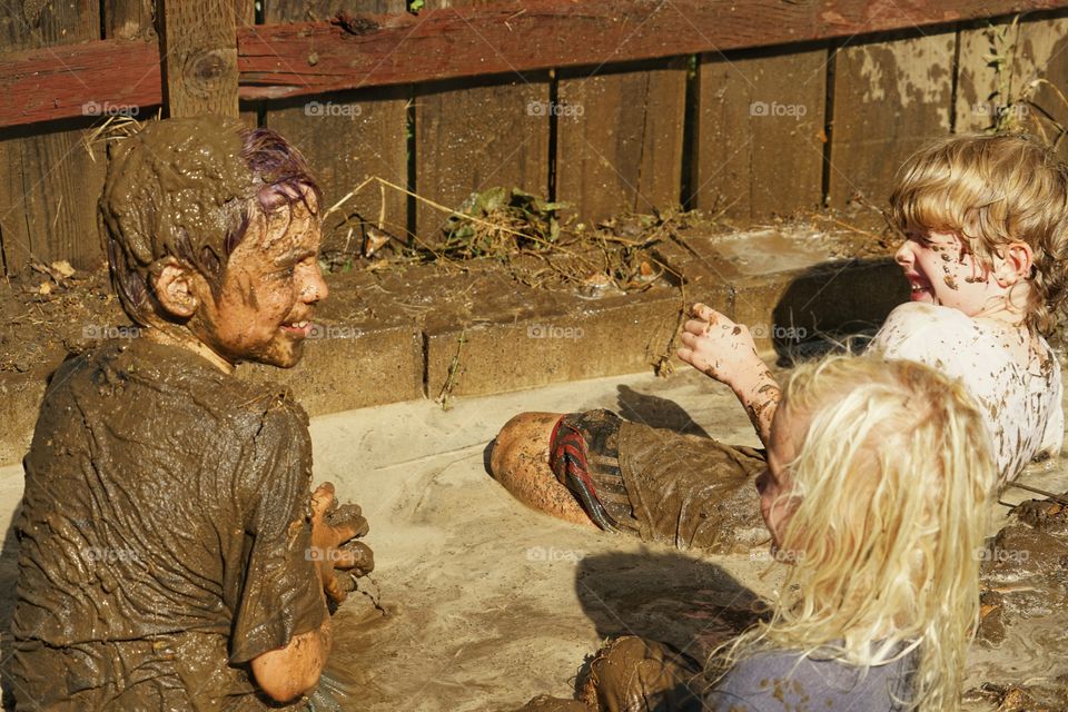 Young Boys Playing In Mud