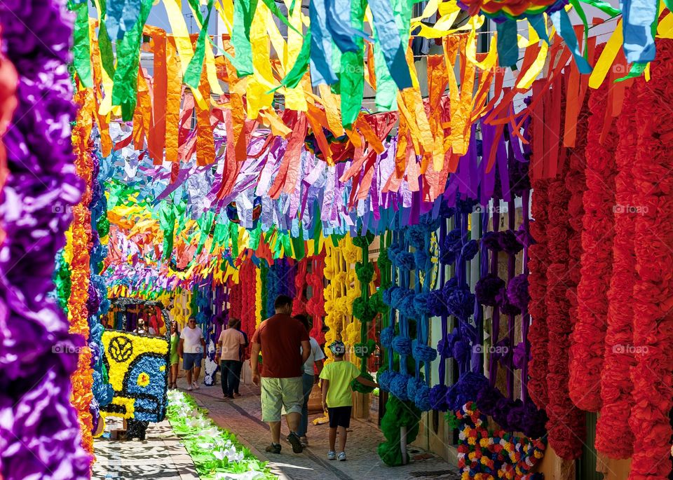 Summer is festival season - people enjoy exploring the decorated streets for Festas Dos Tabuleiros in Tomar, Portugal 