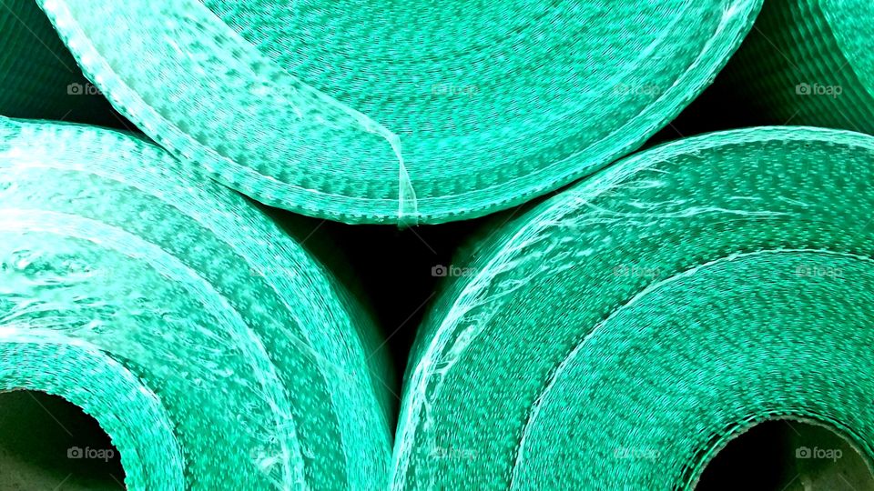 rolls of green plastic netting