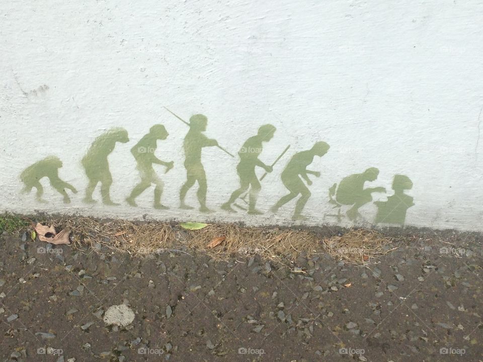 Graffiti of the evolution of man (humorous) from Kilkeel, Northern Ireland, County/Down/Newry