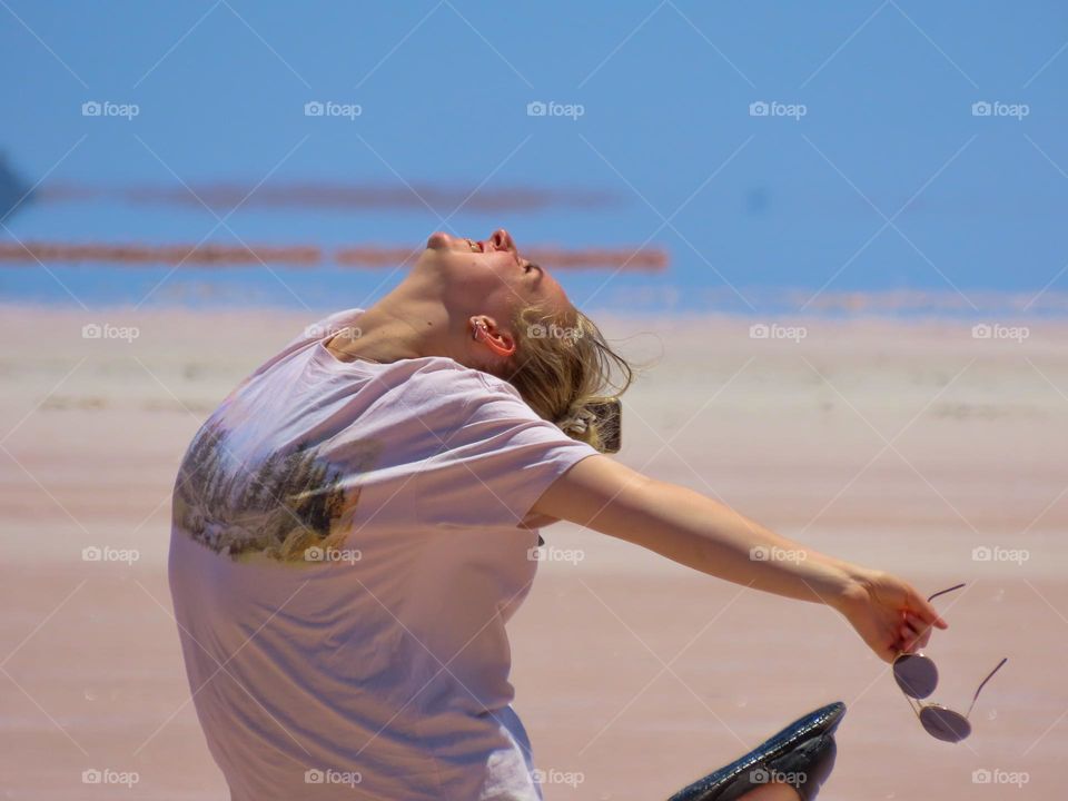 Girl dancing on a salt lake