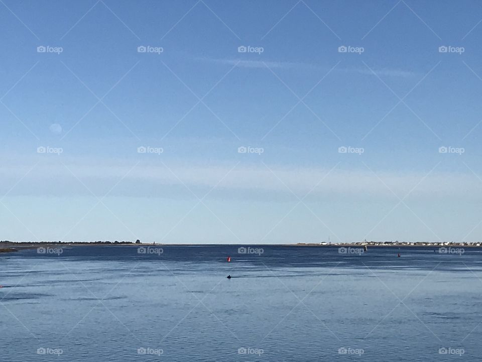 Blue Atlantic Ocean merged into Merrimack River in Newburyport, MA