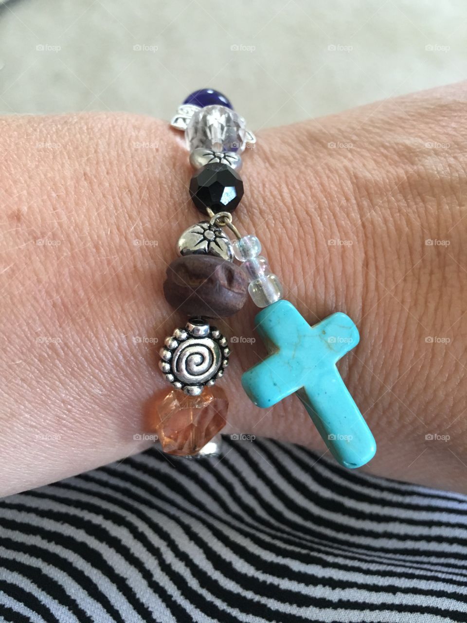 Grandmothers are known for their love and prayers for their families. This beautiful beaded cross bracelet was one such gift of love and prayers!