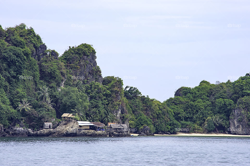 Wooden houses built on rocks in the koh Maphrao at Chumphon in Thailand.