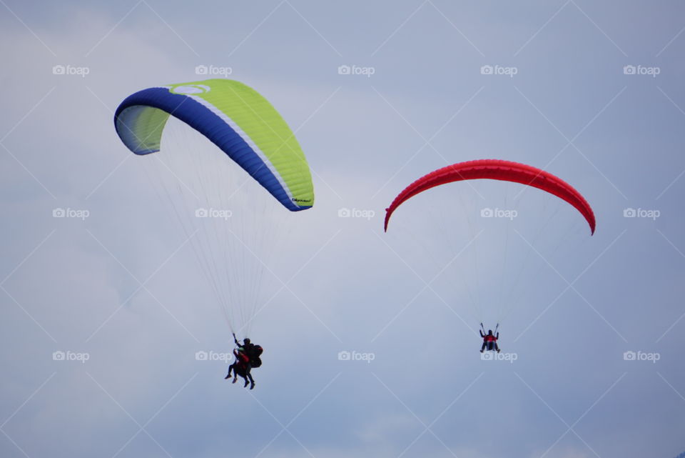 Paragliders in Interlaken. Two paragliders navigate around each other in Interlaken, Switzerland.