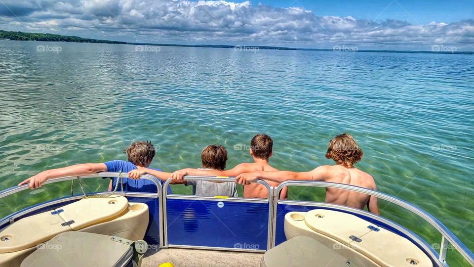 Brothers on a pontoon boat