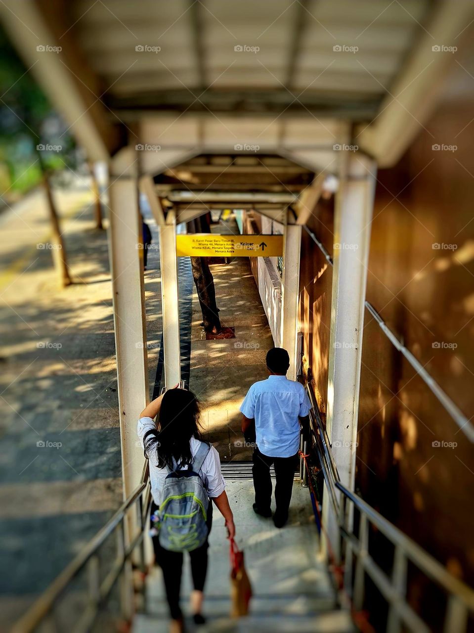 Walking Down Pedestrian Bridge