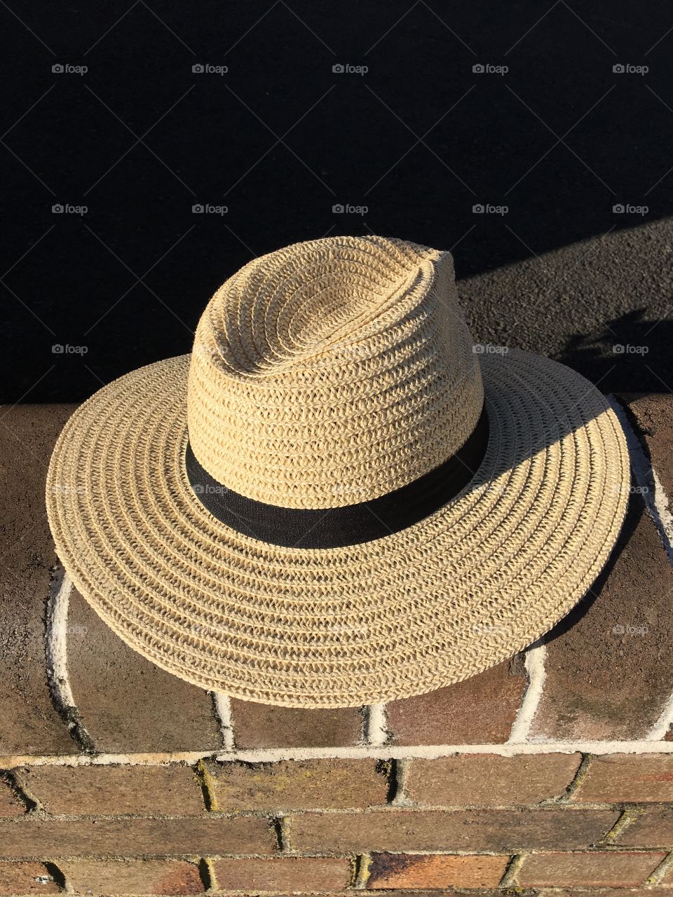 Hat on the brick wall
