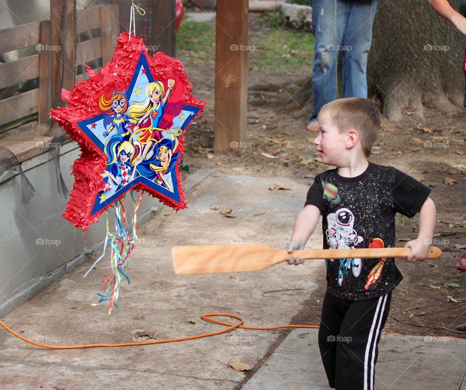 Little Boy Hitting a Piñata 