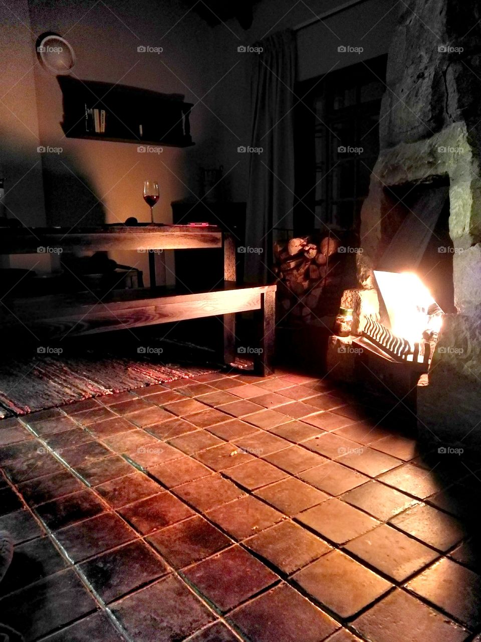 Warm fire in stone cabin.