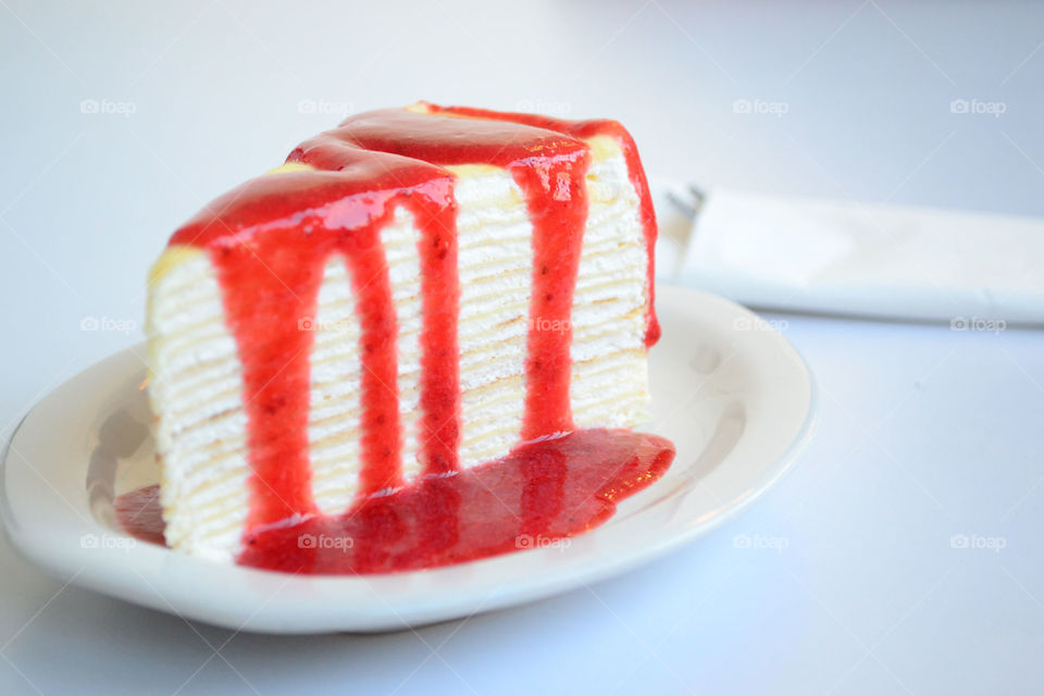 crepe cake with strawberry sauce