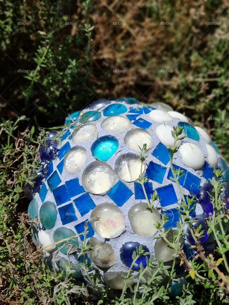 blues of the ocean, whites of the sky clouds, all bundles up in a small garden ornament, made with love.