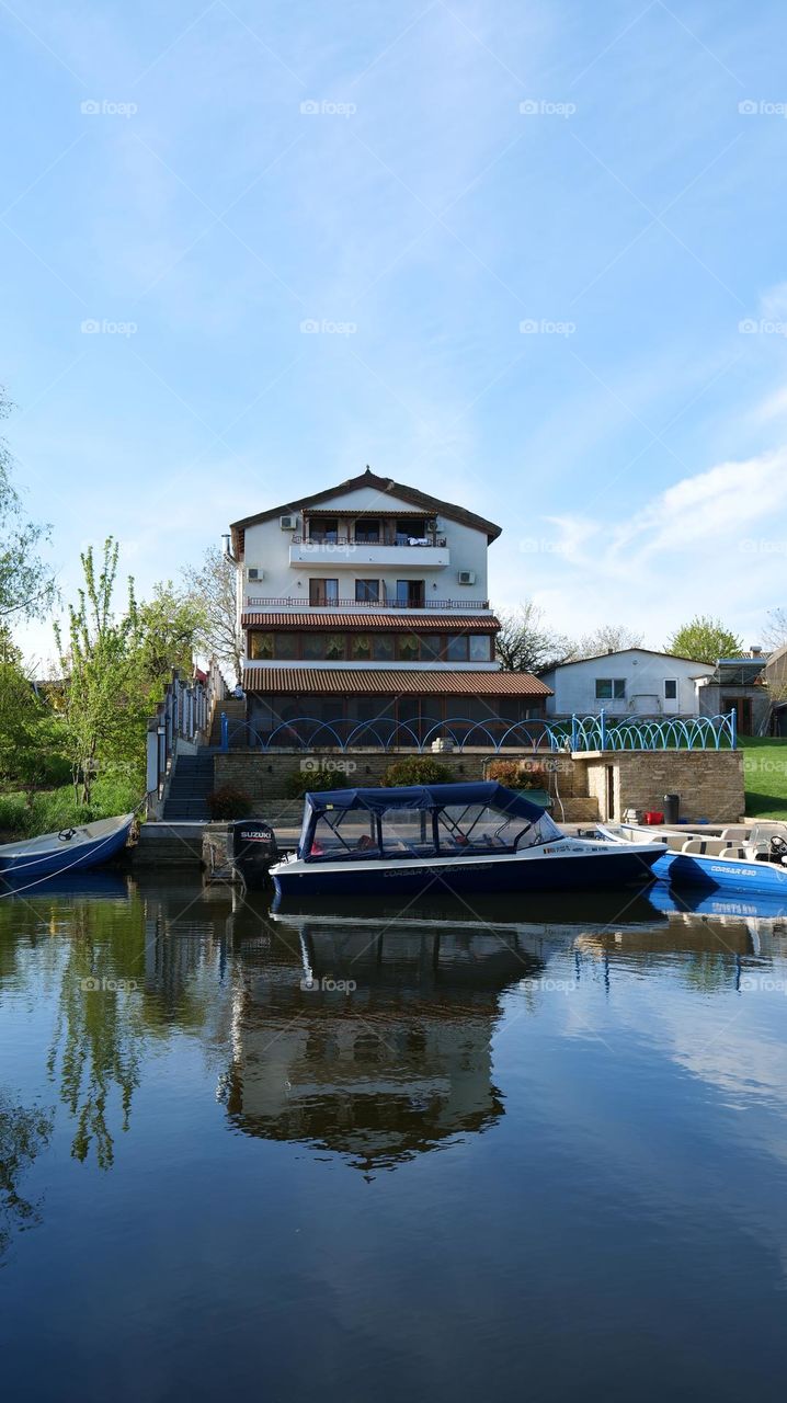 Home, boat and blue sky