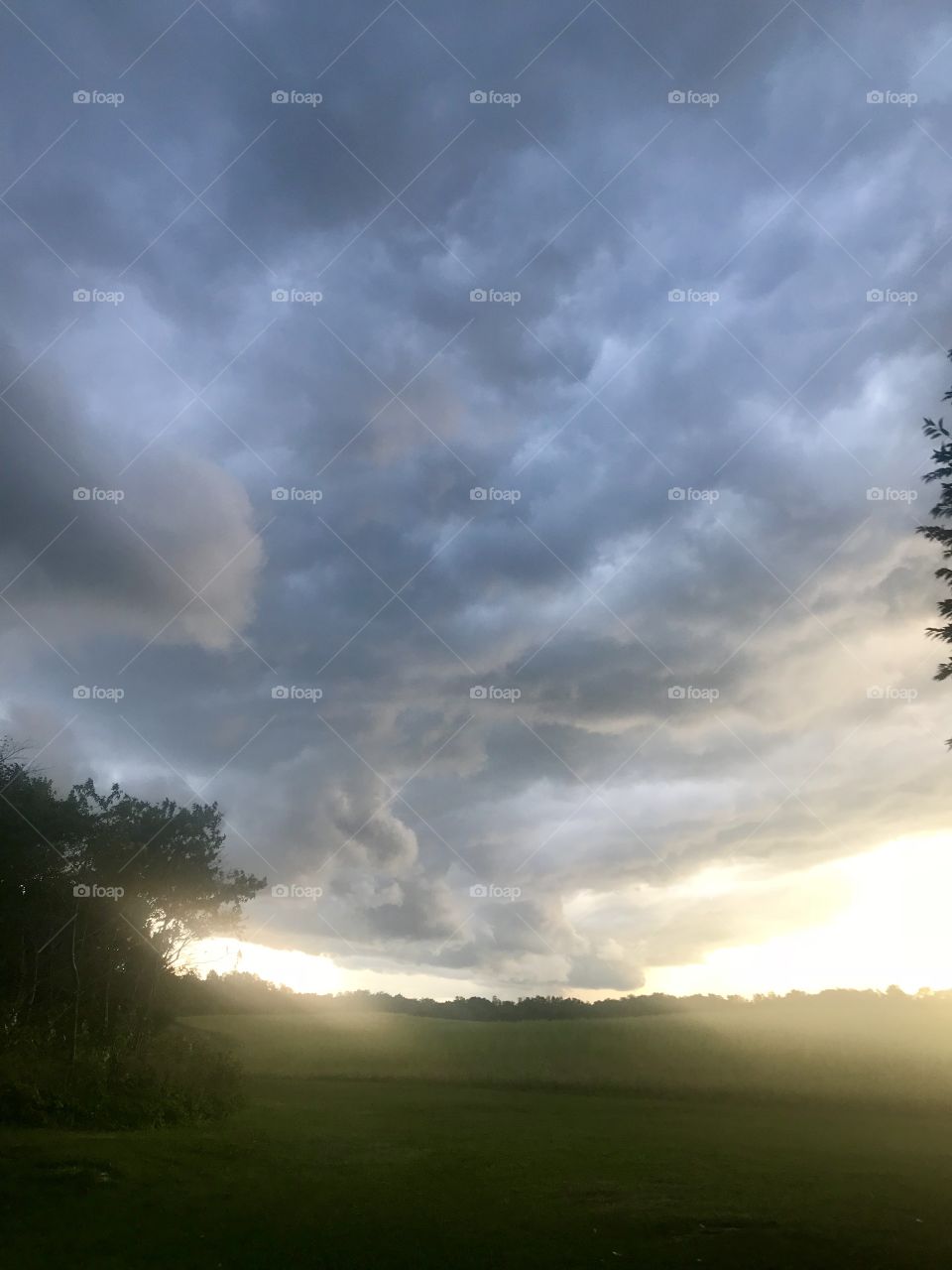 Storm clouds with sun